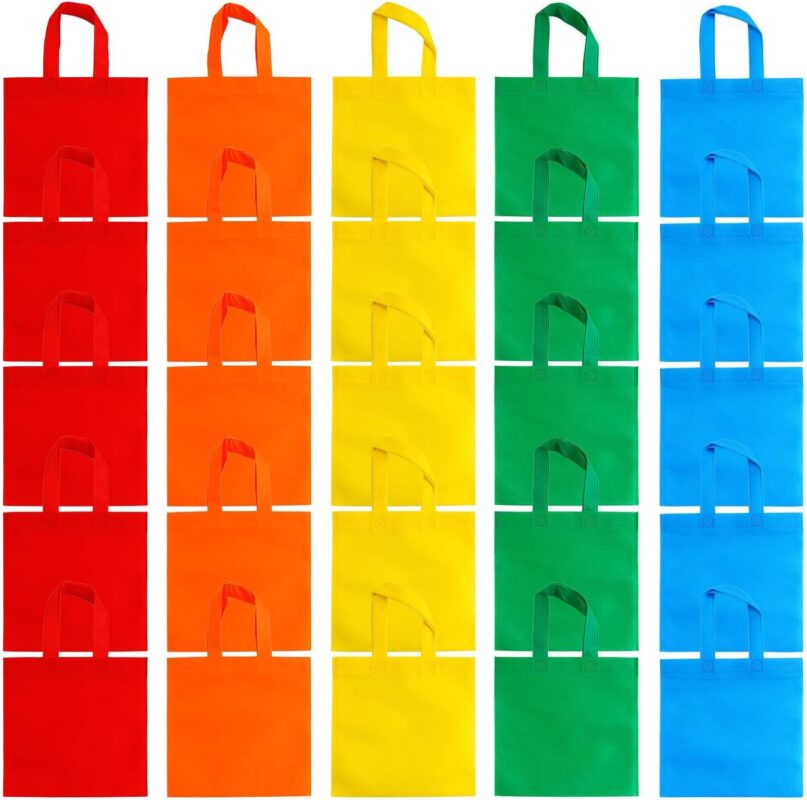 A stack of 25 Aneco non-woven party favor bags in assorted rainbow colors: red, orange, yellow, green, and blue.