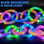 A set of 12 glowing light-up wands in various colors including green, red, blue, pink, orange, and purple.