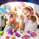 A set of 24 small, multi-colored galaxy slime jars with shimmering textures, packaged together for party favors.