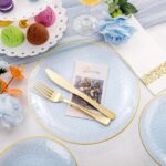 Rubtlamp 175-piece blue plastic dinnerware set with gold rim, including plates, cups, cutlery, and napkins for a party.